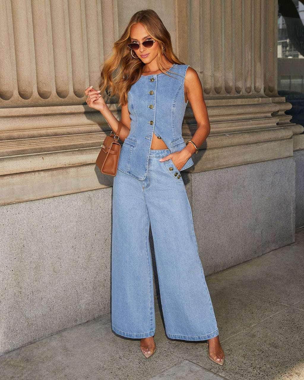 Woman in chic denim vest and wide-leg jeans, sunglasses, and brown bag, ZA-Zola fashion