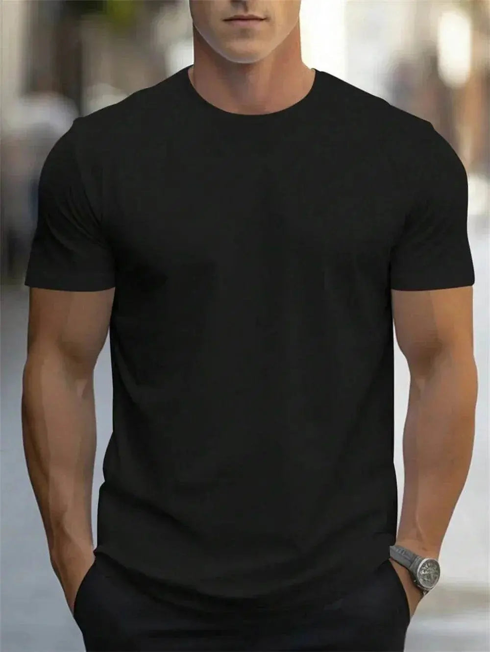 Man wearing a plain black short sleeve t-shirt from ZA-Zola, casual street style
