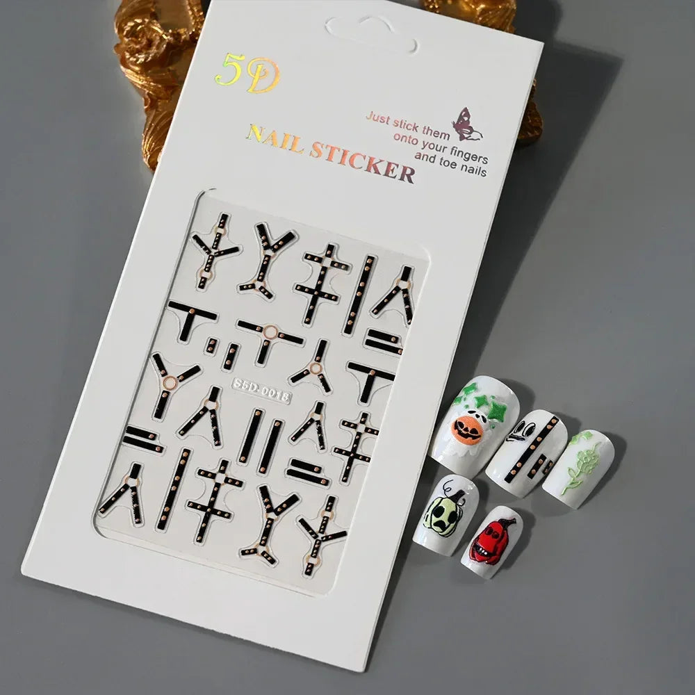 5D nail sticker set with black and gold designs, Halloween-themed nail art samples