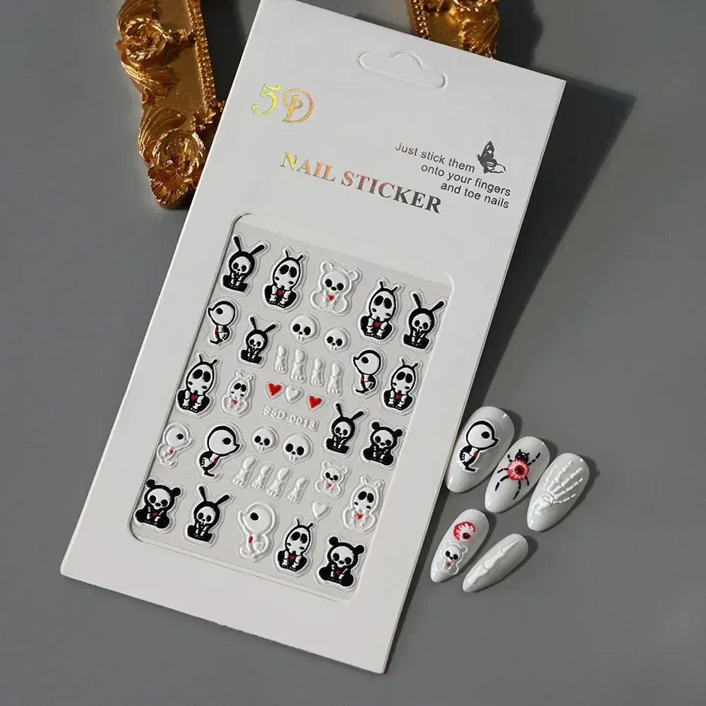 3D black and white skull and cartoon animal nail stickers on white packaging, with decorated press-on nails.