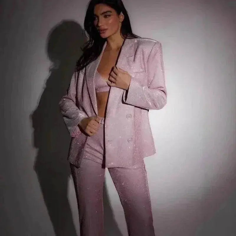 Woman modeling pink sequin bra, blazer, and trousers party suit set from ZA-Zola fashion.