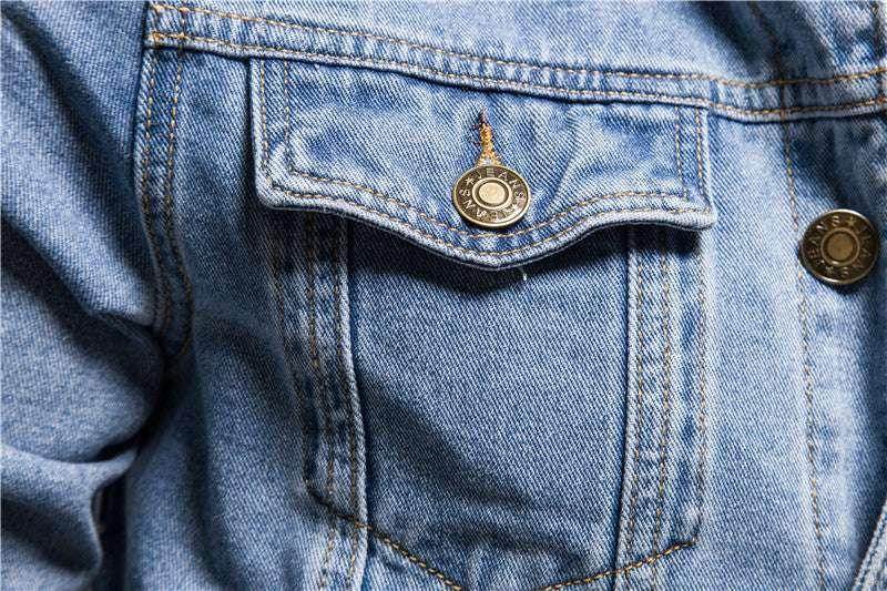 Close-up of slim fit cotton denim jacket pocket with metal buttons from ZA-Zola UK fashion store.