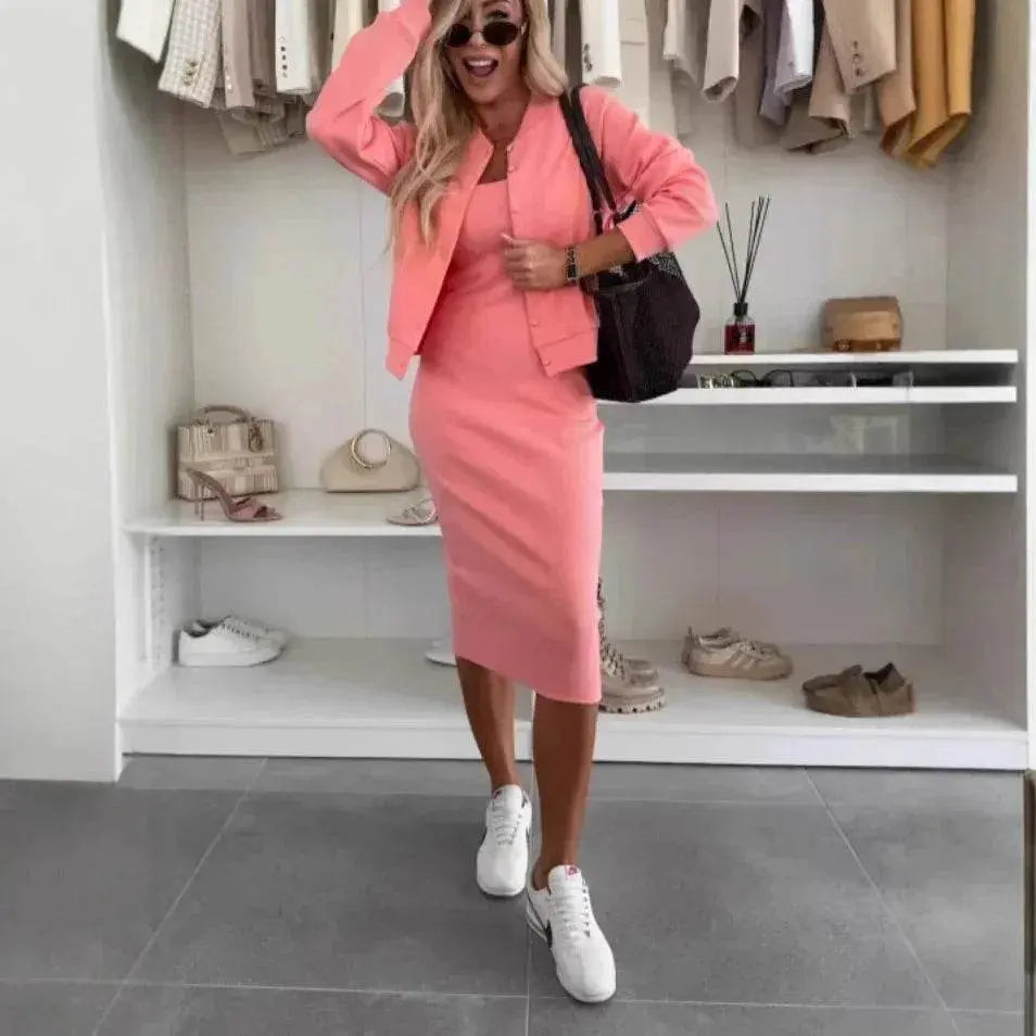 Woman in pink two-piece dress and cardigan set with white sneakers, posing in modern closet, ZA-Zola fashion.