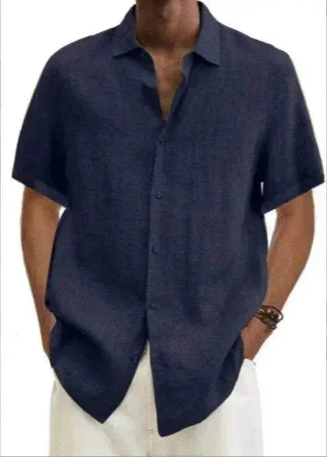 Man wearing a navy V-neck cotton linen shirt from ZA-Zola, minimalist summer style