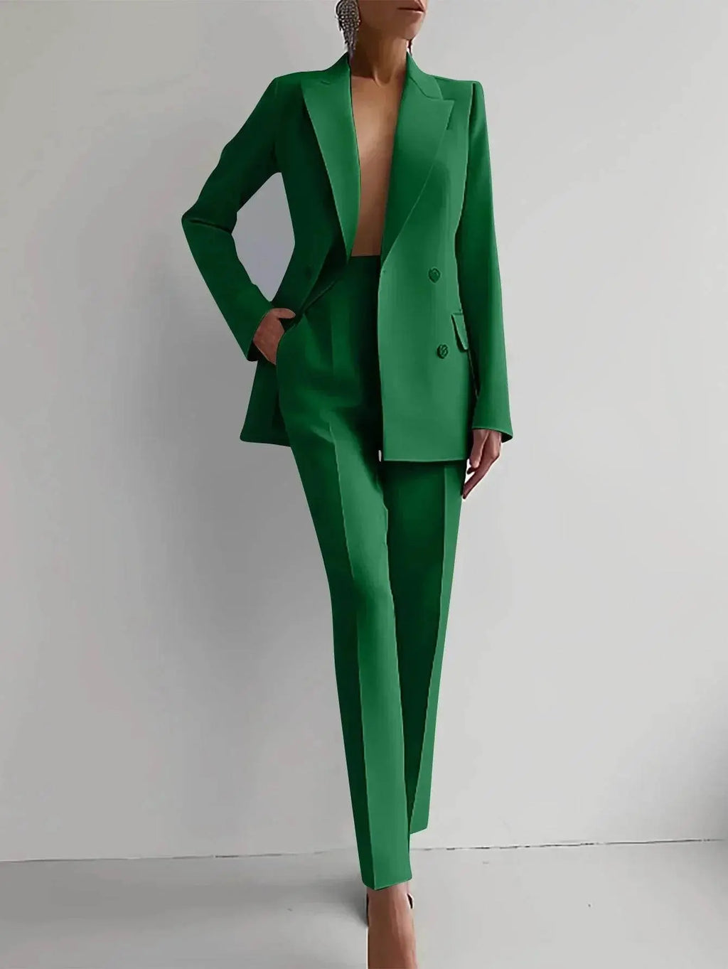 Woman modeling chic green suit set with blazer and slim pants from ZA-Zola fashion collection