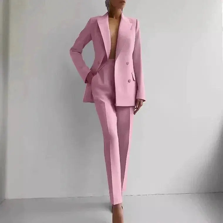 Woman wearing pink slim-fit blazer and pants suit from ZA-Zola against white background