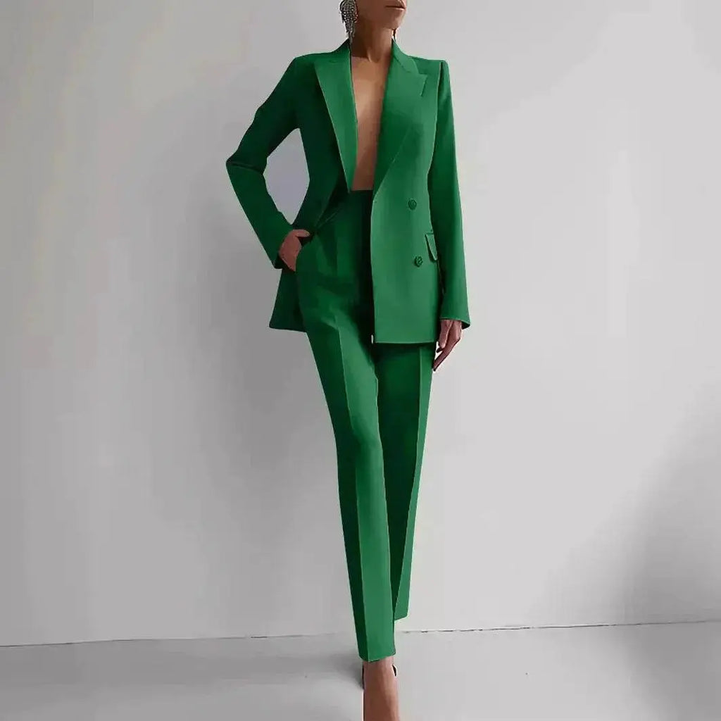 Woman modeling a green blazer and slim pants suit set from ZA-Zola against a white background.