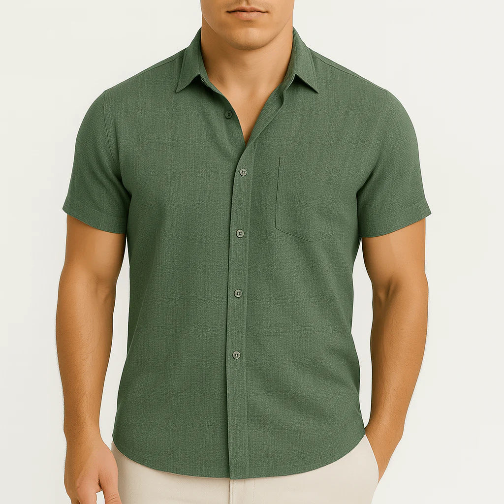 Man wearing a green short-sleeve shirt on a white background
