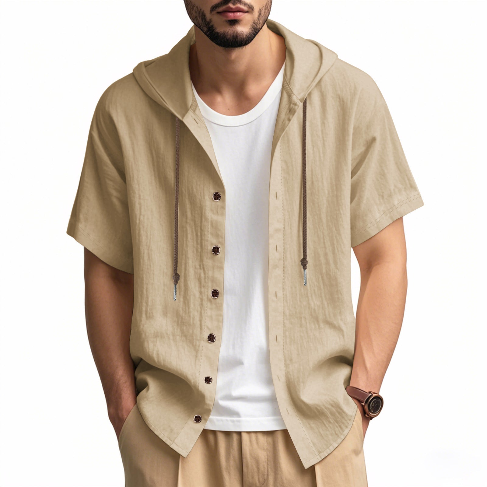 Man wearing a beige short-sleeve button-up shirt over a white t-shirt on a white background