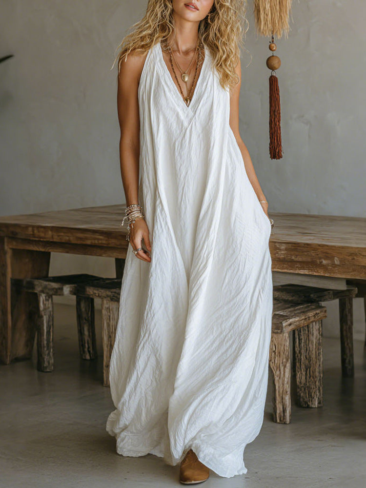 Woman wearing a white dress in a rustic indoor setting
