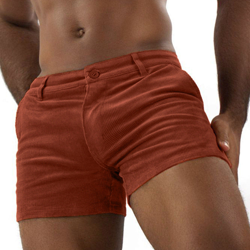 Red shorts worn by a person on a white background