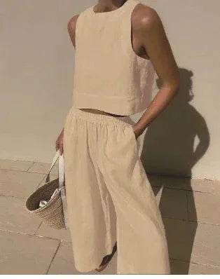 Woman wearing beige sleeveless top and wide-leg pants, holding a woven tote bag, ZA-Zola fashion