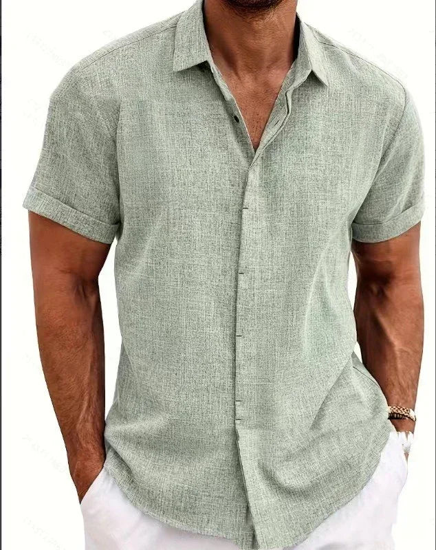 Man wearing a green short-sleeve shirt with a white background