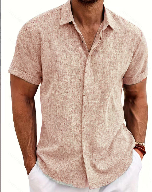 Man wearing a beige short-sleeve shirt with a white background