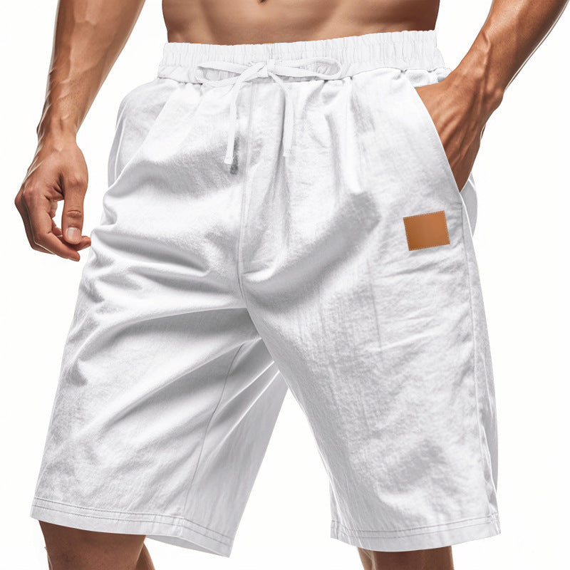 White shorts with a brown patch on a white background