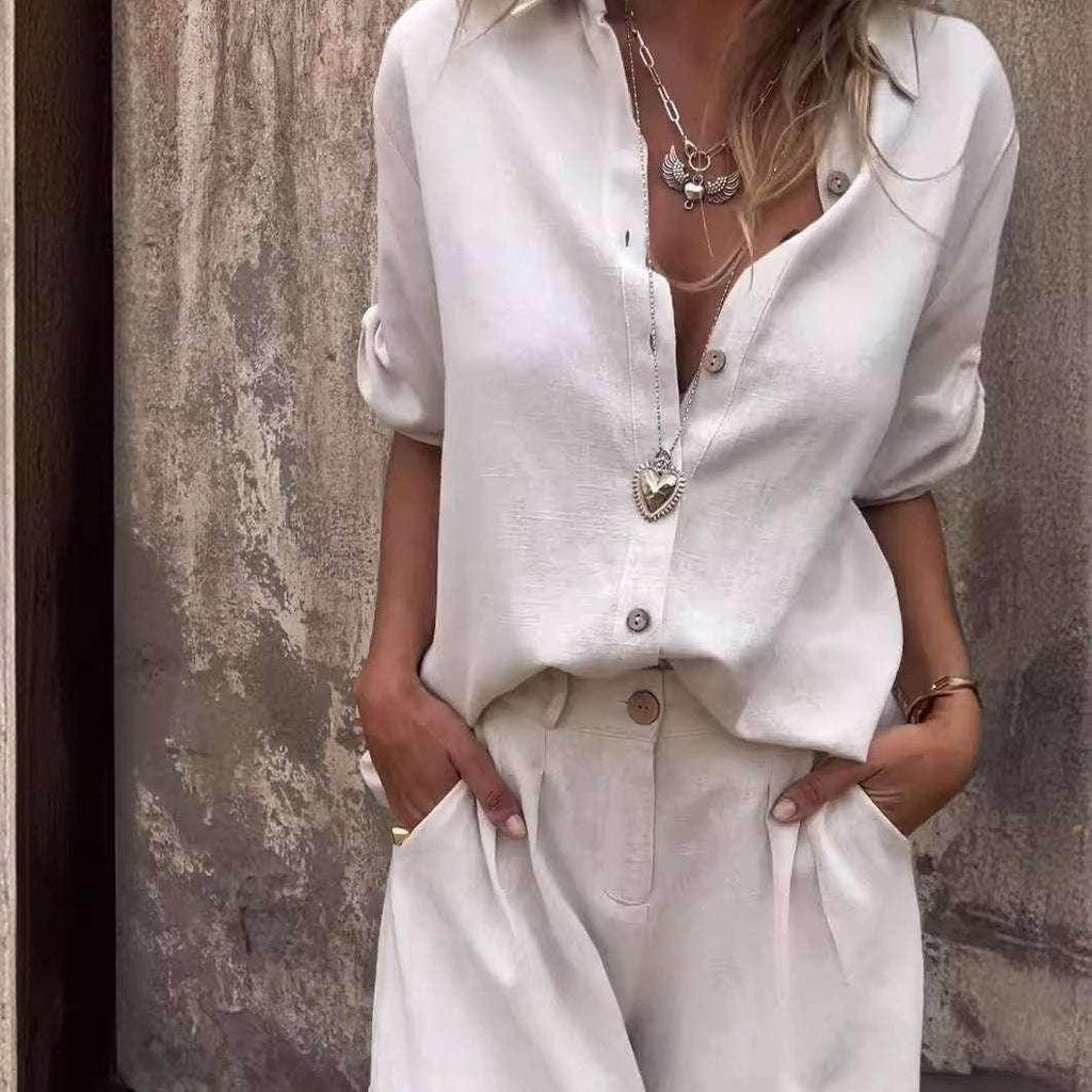 Woman in stylish cream linen shirt and pants, layered necklaces, ZA-Zola fashion UK