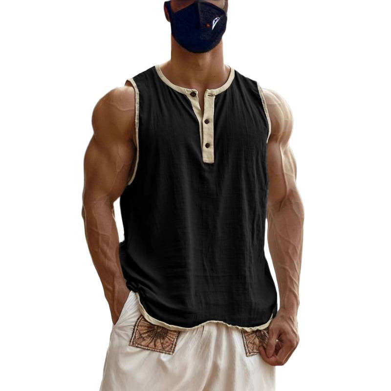 Person wearing a black sleeveless shirt with beige accents and white pants on a white background