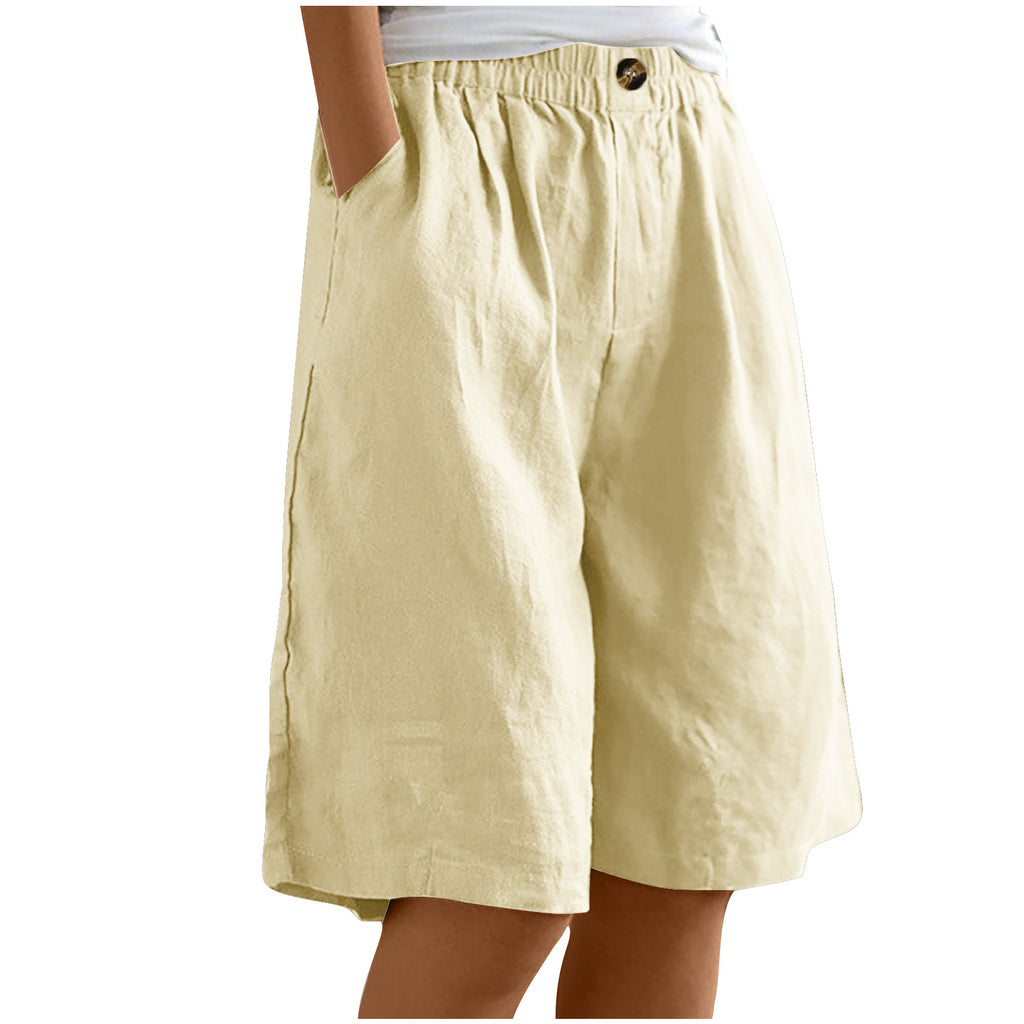 Beige shorts worn by a person on a white background
