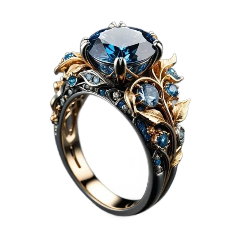 Elaborate ring with blue gemstones and gold accents on a white background