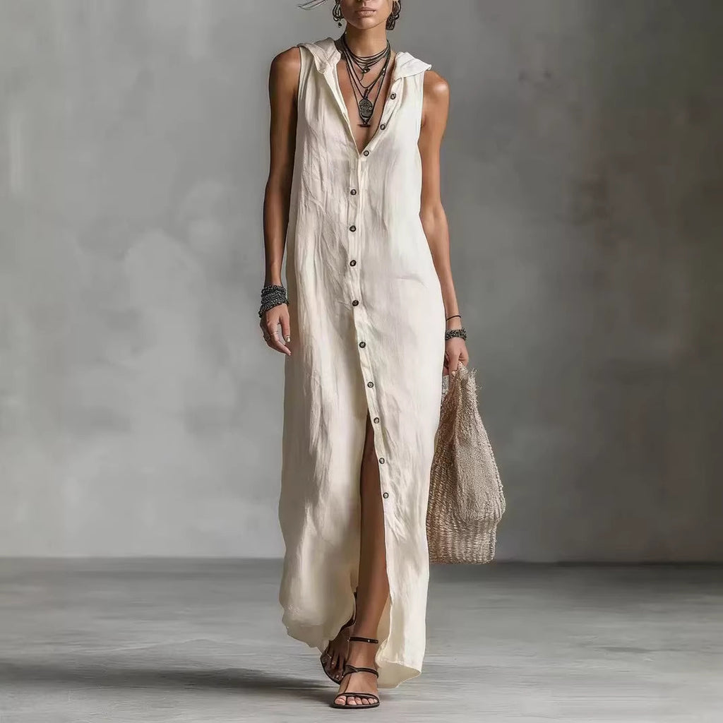 Woman wearing a long beige dress with a textured background
