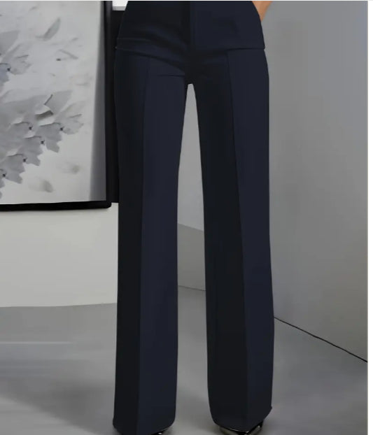 Navy blue pants worn by a person against a neutral background