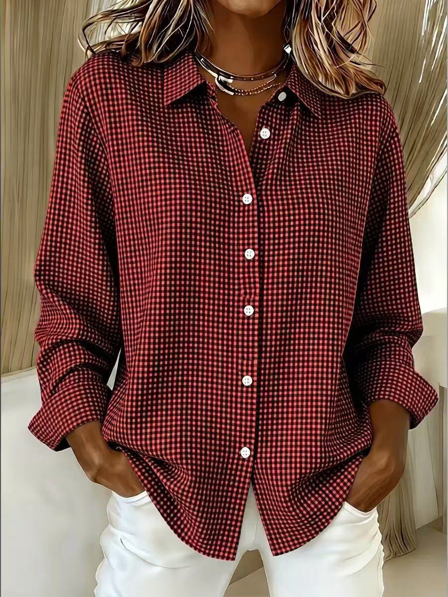 Red and black checkered shirt worn by a person with a neutral background