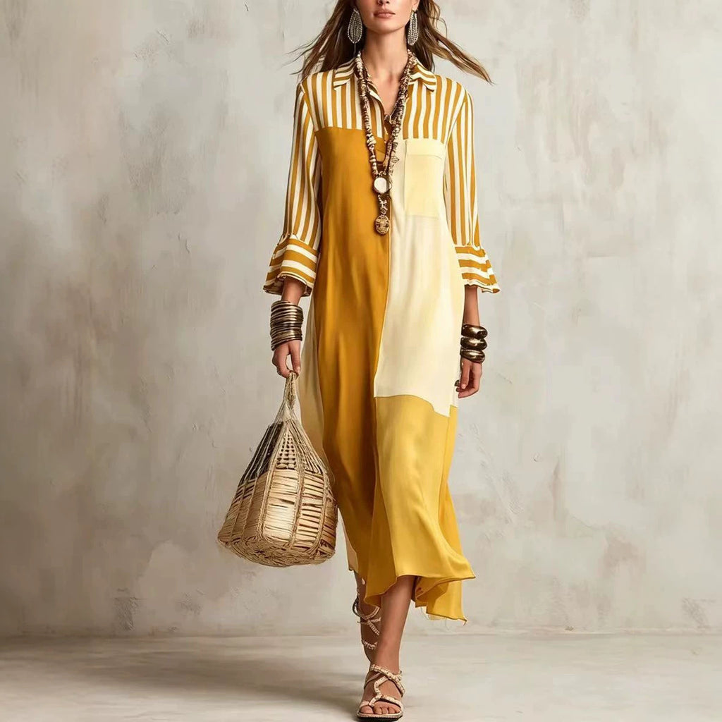 Woman wearing a yellow and white striped dress holding a woven bag against a neutral background