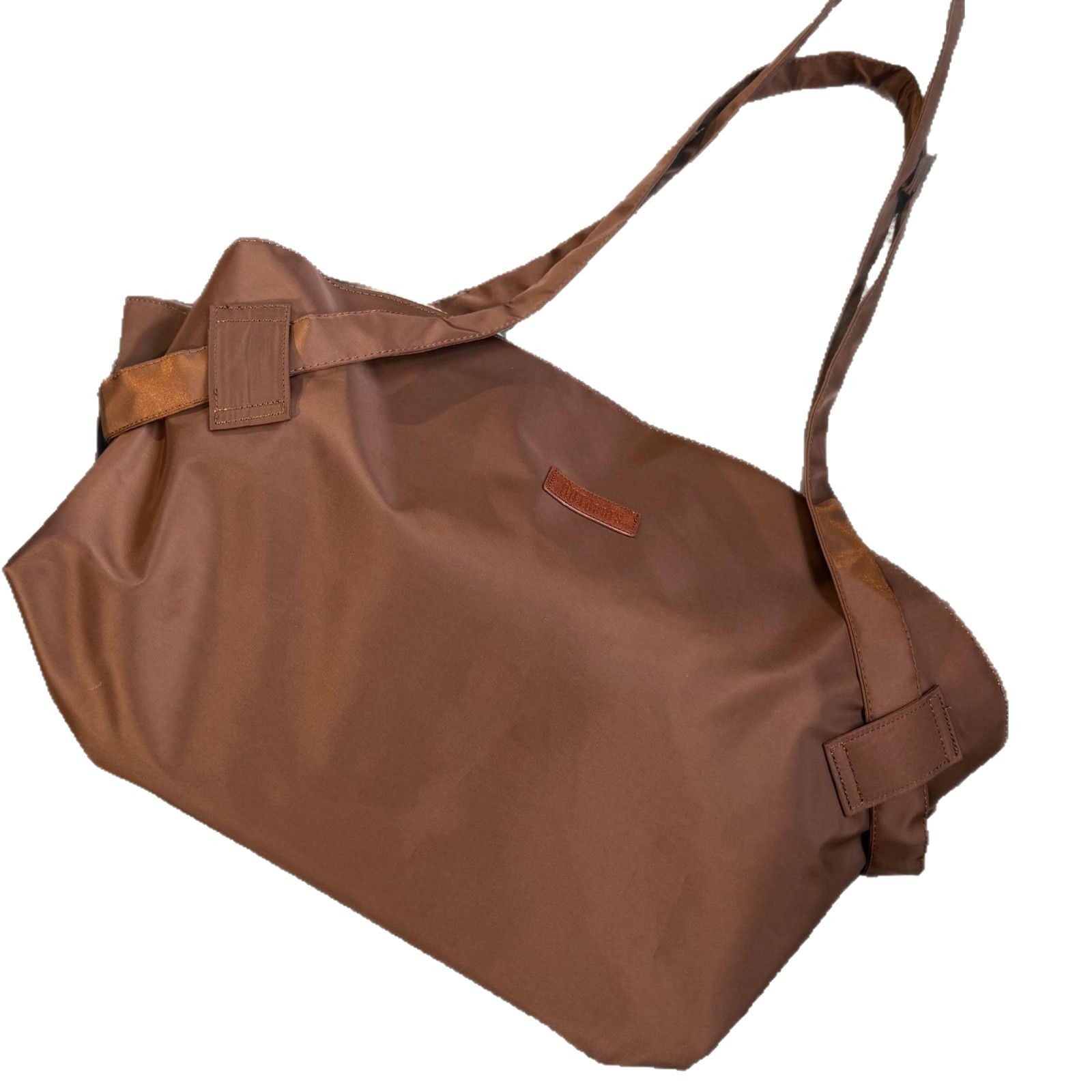 Brown bag with straps on a white background
