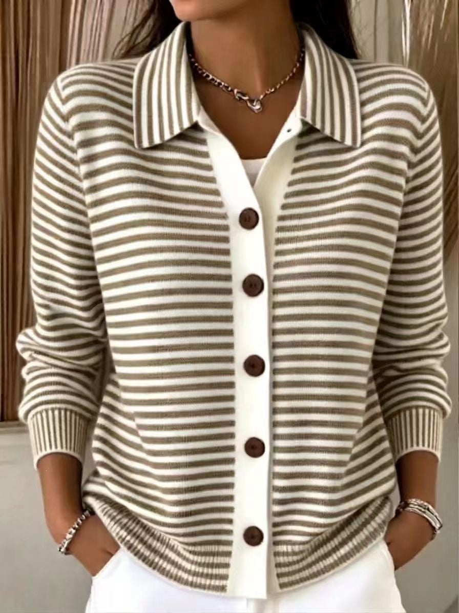 A woman wearing a beige and brown horizontally striped knit cardigan with a white placket and dark brown buttons, layered over a white top.