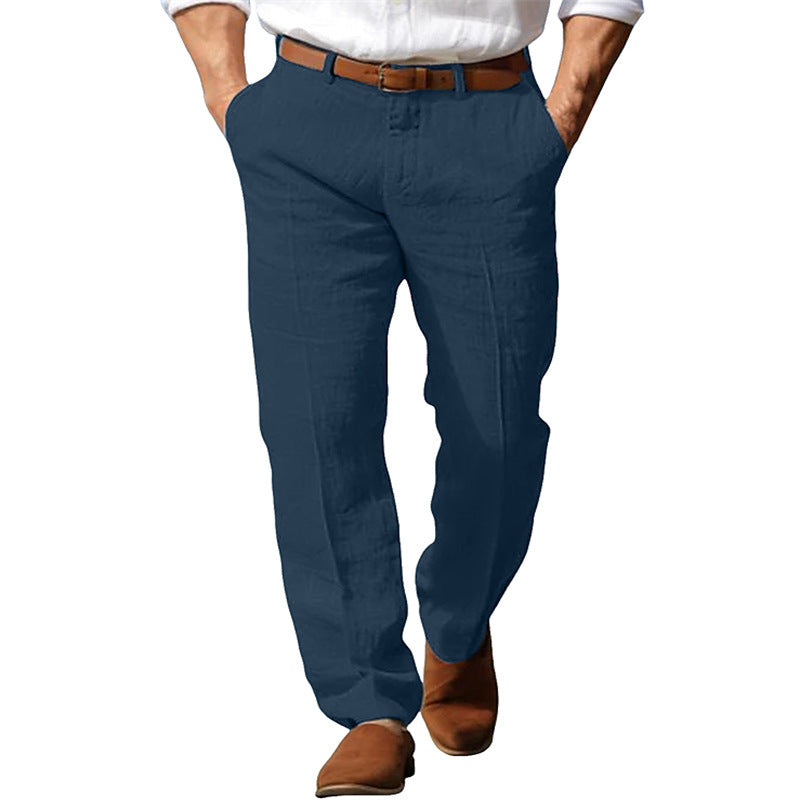 Blue pants worn by a person on a white background
