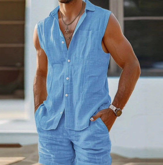 Man wearing a sleeveless blue shirt and shorts with a blurred background