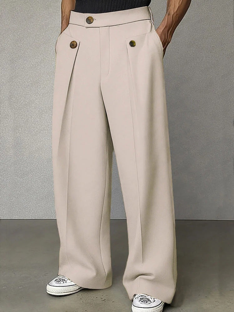 Beige wide-leg pants worn by a person on a gray background