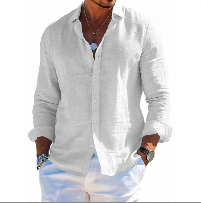 Man wearing a white button-up shirt and light blue pants on a white background