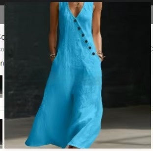 Blue dress with black buttons on a dark background