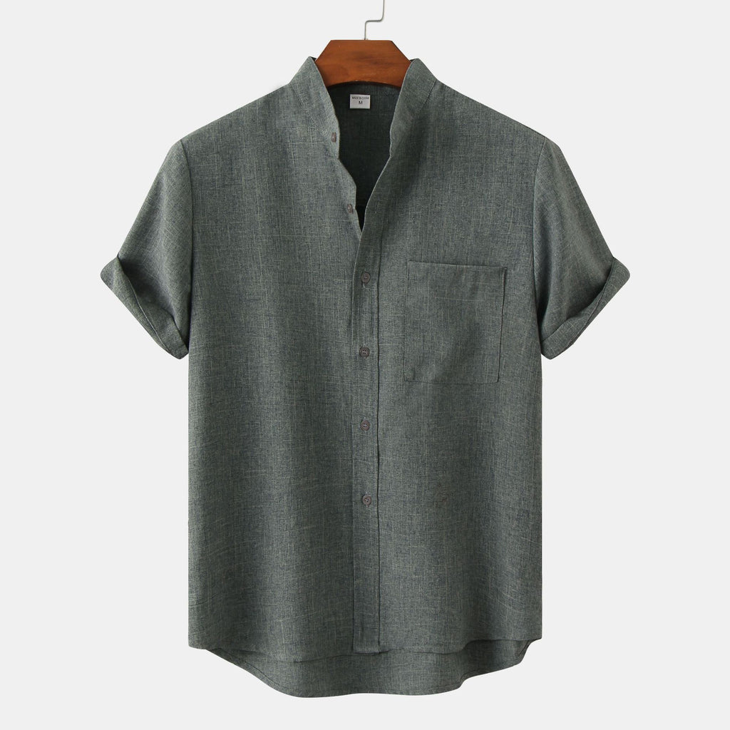 Gray short-sleeve shirt on a hanger against a white background