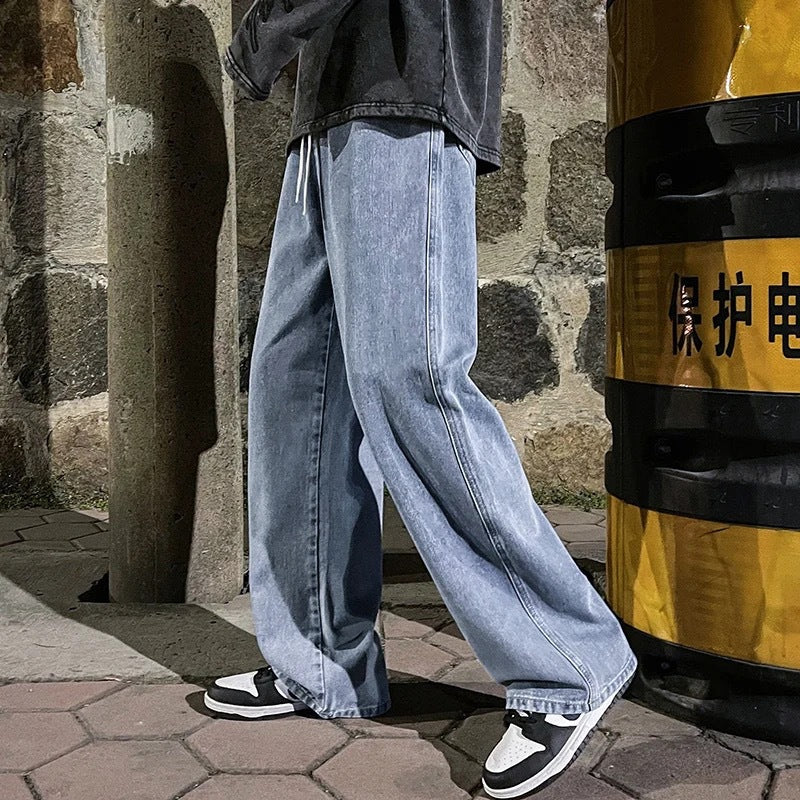 Person wearing blue jeans standing next to a yellow and black barrel with Chinese text.