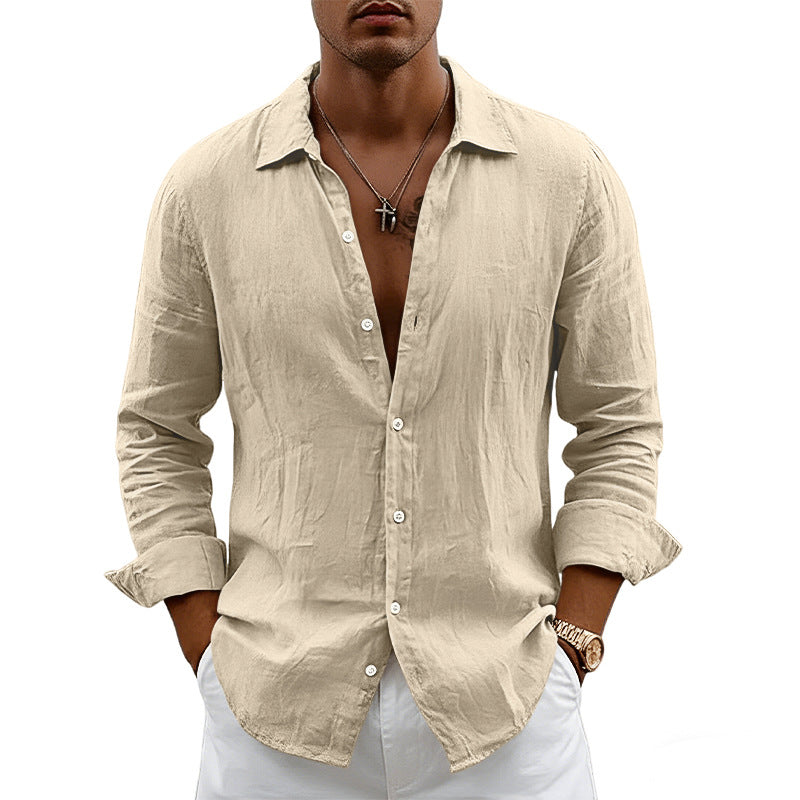 Man wearing a beige button-up shirt with rolled-up sleeves on a white background