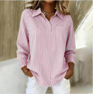 Person wearing a red and white striped shirt with a neutral background