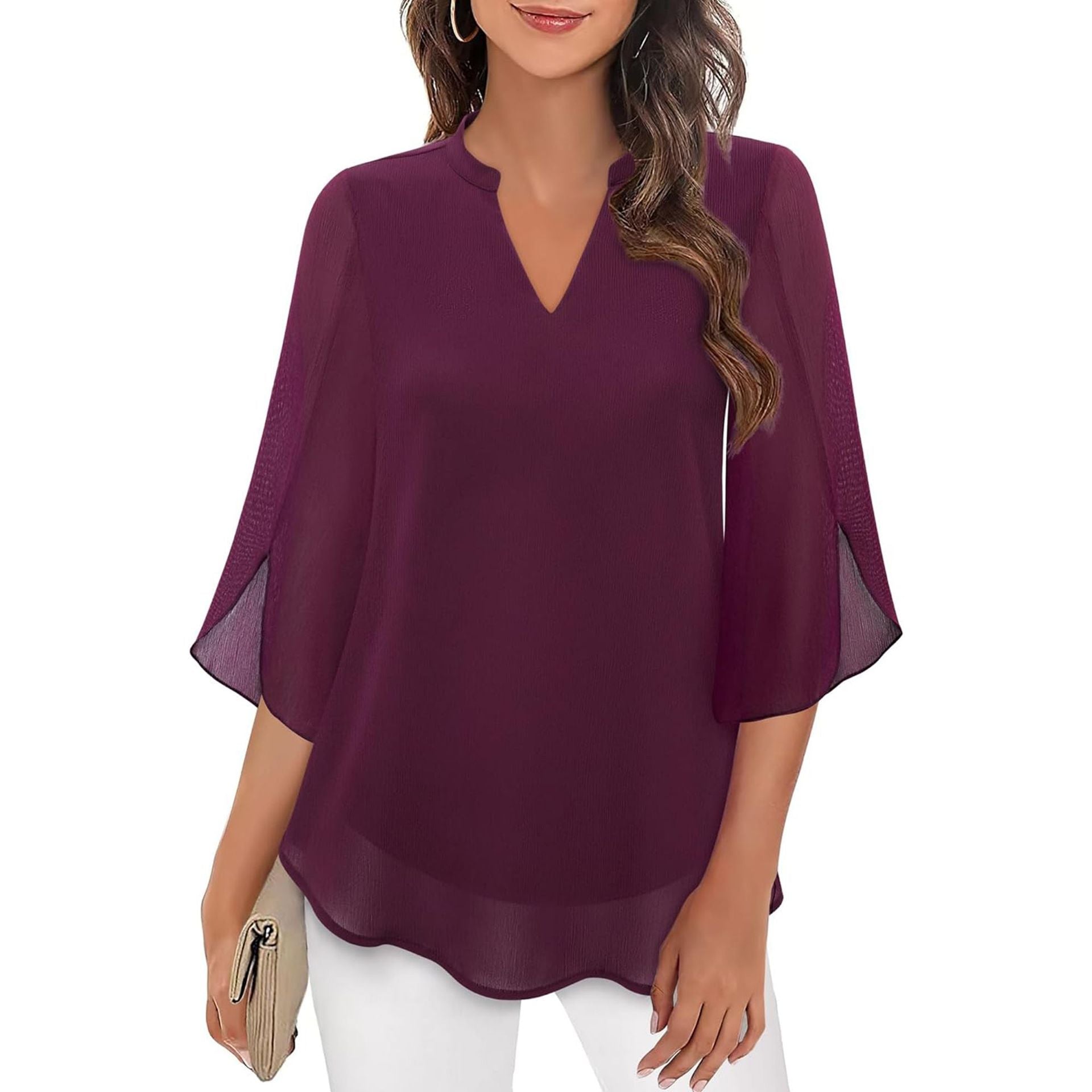 Purple blouse with sheer sleeves worn by a model on a white background