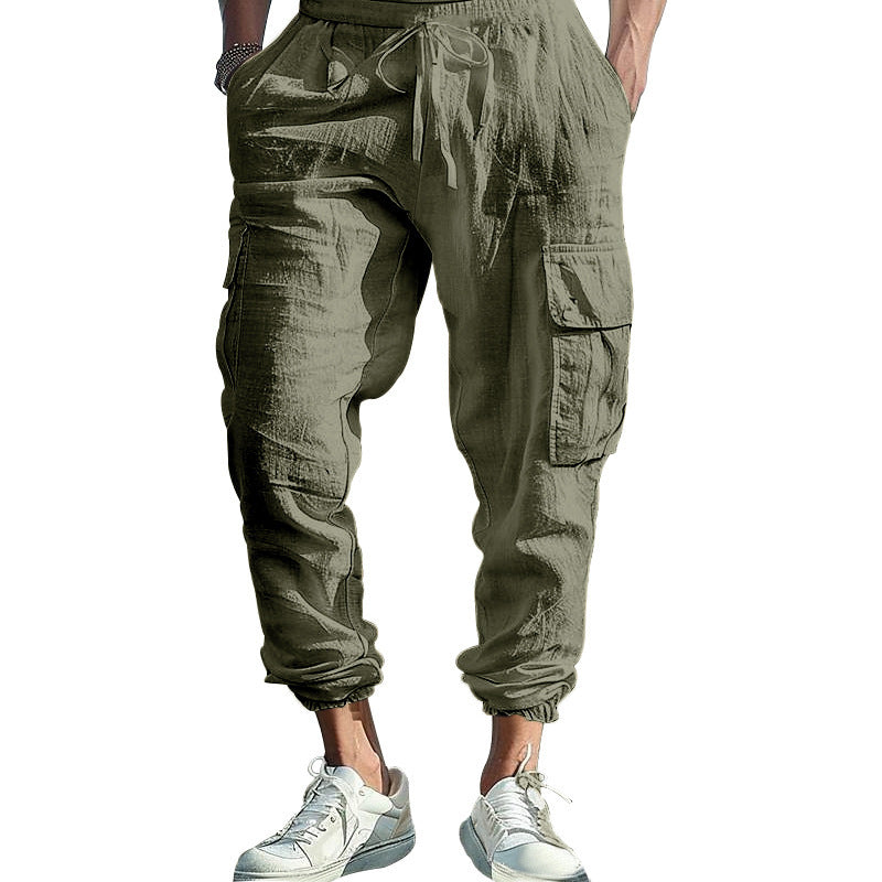 Gray cargo jogger pants worn by a person on a white background