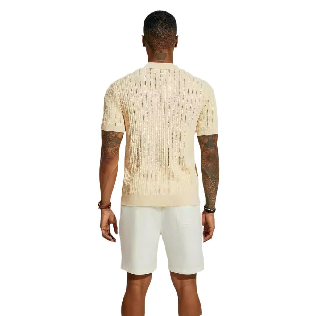 Man wearing a beige ribbed shirt and white shorts on a white background