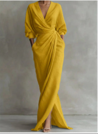 Mustard yellow evening gown on a plain background