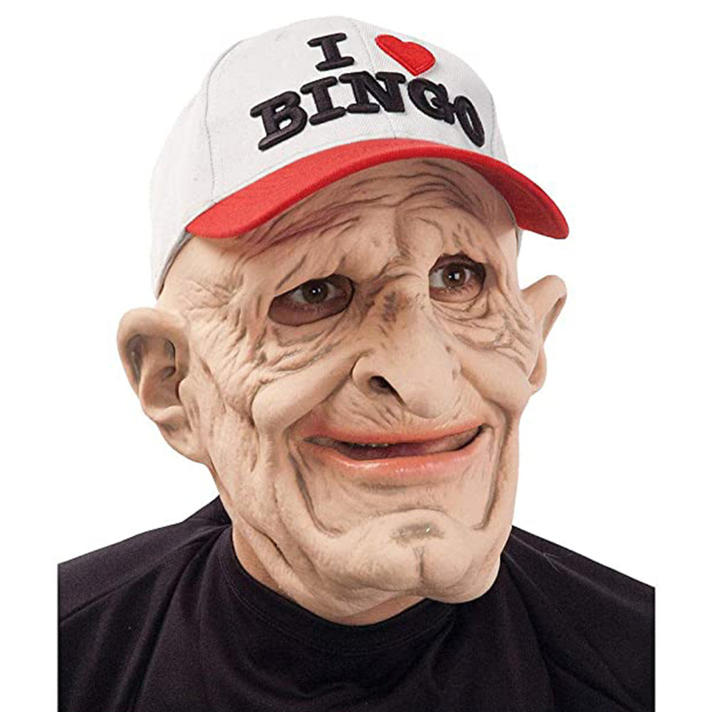 A person wearing a realistic latex clown mask with wrinkled skin and a white cap with red brim and black text reading 'I BINGO' with a red heart, against a plain white background.