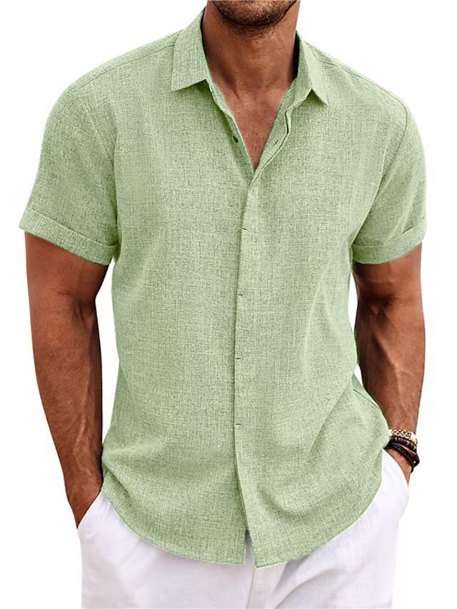 Man wearing a green short-sleeve shirt with white pants on a white background