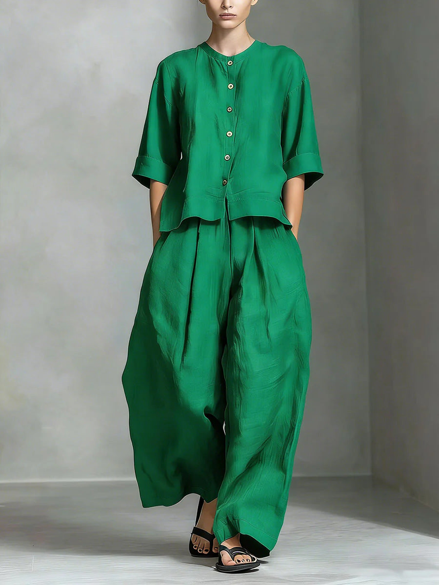Person wearing a green outfit with a plain background