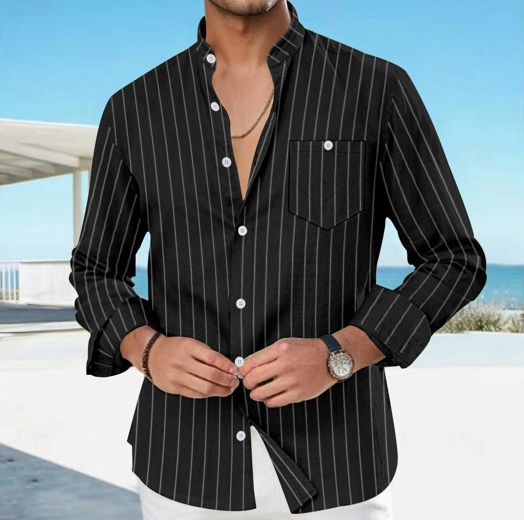 Man wearing a black pinstripe shirt with a blurred outdoor background