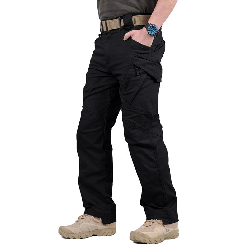 Person wearing black tactical pants on a white background