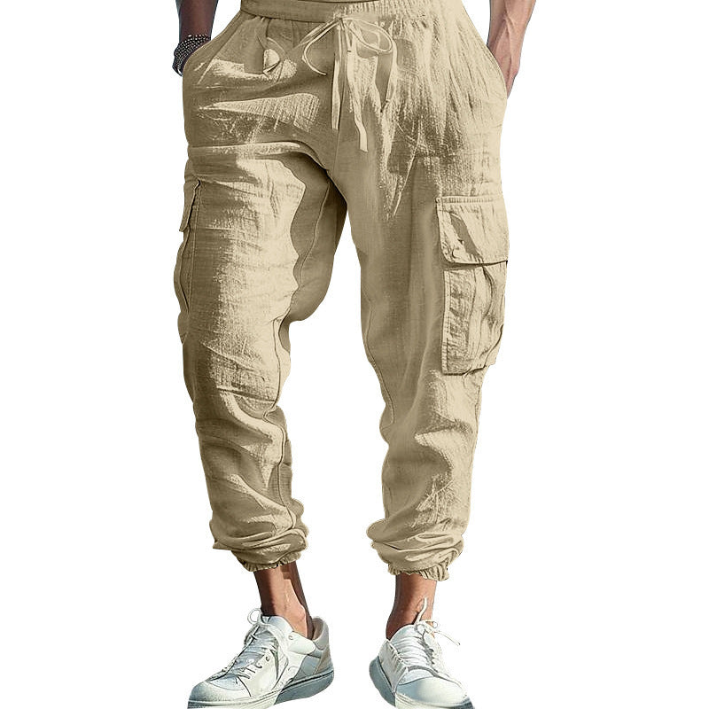 Beige cargo jogger pants worn by a person on a white background