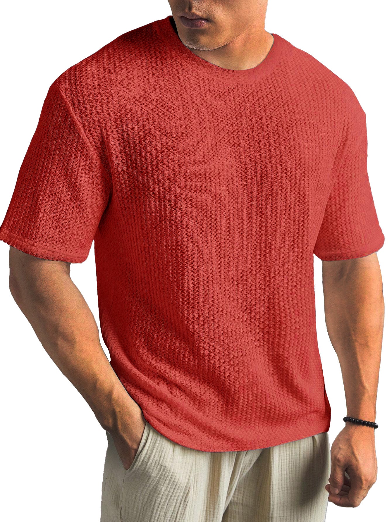 Man wearing a red textured t-shirt on a white background
