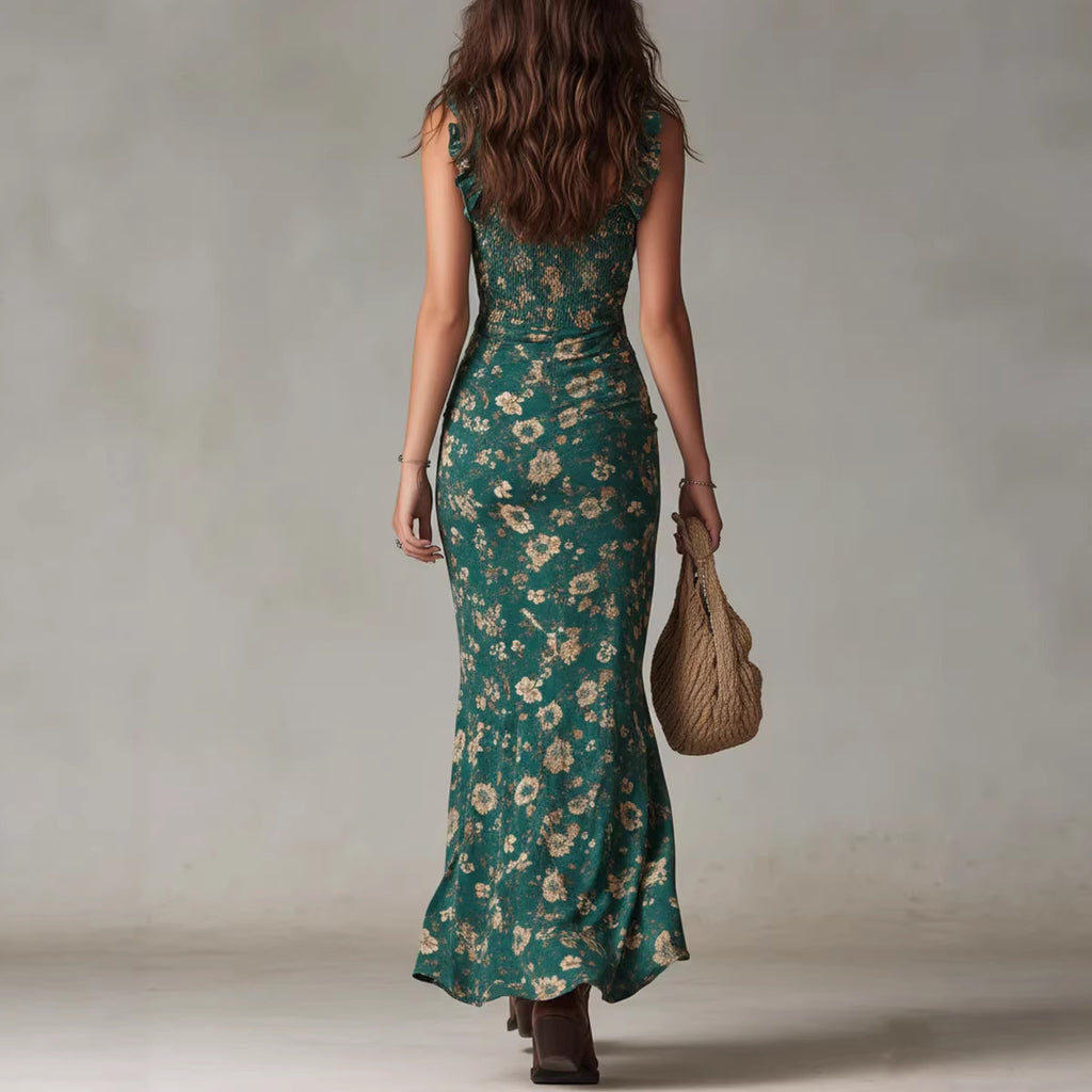 Woman wearing a green floral dress holding a woven bag against a neutral background